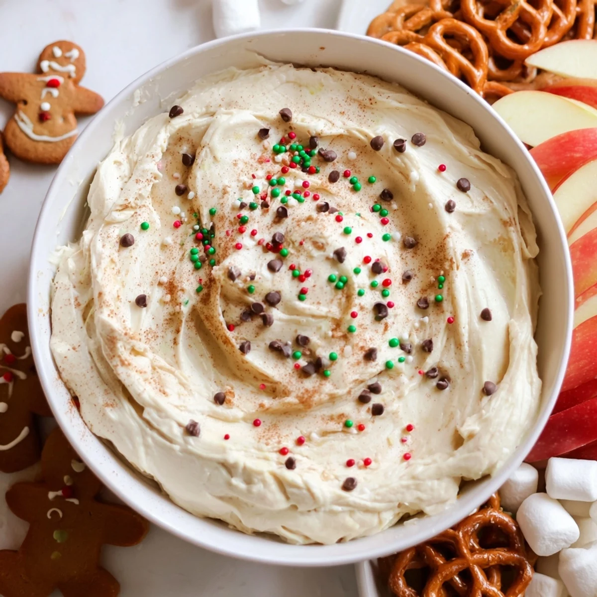 Creamy Gingerbread House Dip Board on a festive platter with assorted cookies and dippables.