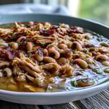 Tender Crock-Pot Black-Eyed Peas with Smoked Turkey beside cornbread and fresh greens.