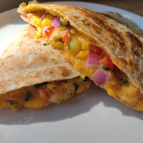 Golden, cheesy Vegetarian Quesadillas filled with beans and vegetables, ready to be served.