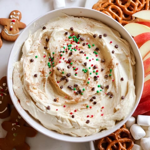 Creamy Gingerbread House Dip Board on a festive platter with assorted cookies and dippables.