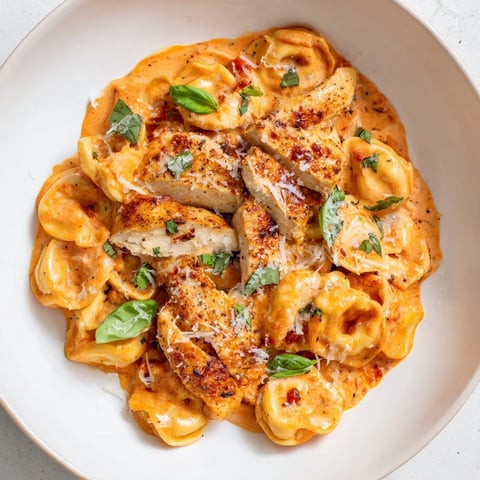 Creamy Marry Me Chicken Tortellini with sun-dried tomatoes and Parmesan, ready to eat.