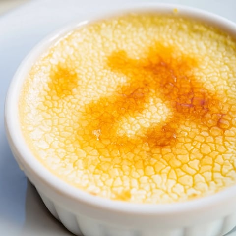 Golden caramelized sugar crust topping a creamy 3-Ingredient Crème Brûlée, ready to be enjoyed.