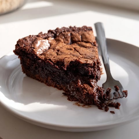 Rich, crackly Ina Garten Brownie Pudding with a molten chocolate center, ready to be served.