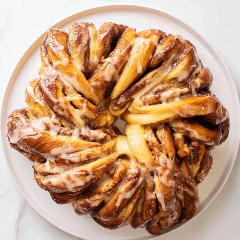 Golden-brown Cinnamon Swirl Christmas Tree Bread, ready to slice and enjoy with coffee.