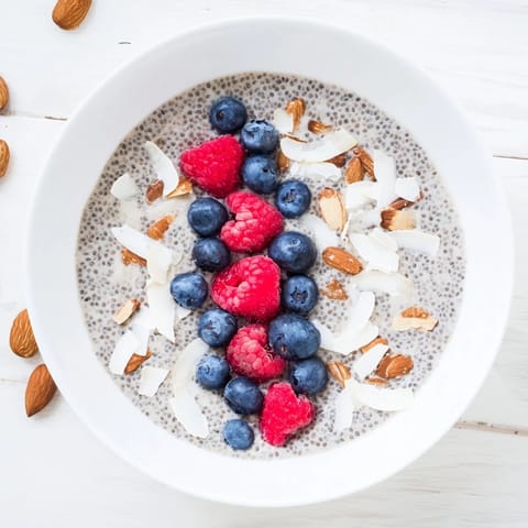 Creamy Poppy Seed Chia Pudding topped with fresh blueberries and toasted almonds for a crunchy, healthy breakfast.